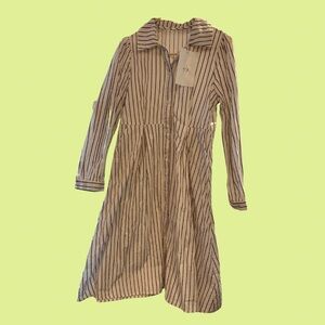 black and white striped midi dress with a collared neckline and pockets